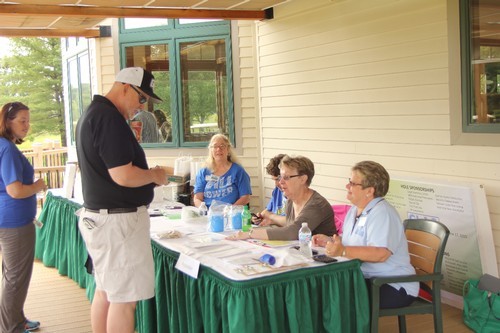Fred at the registration desk s[peaking with Cheryl Smalley and Pat Haynes